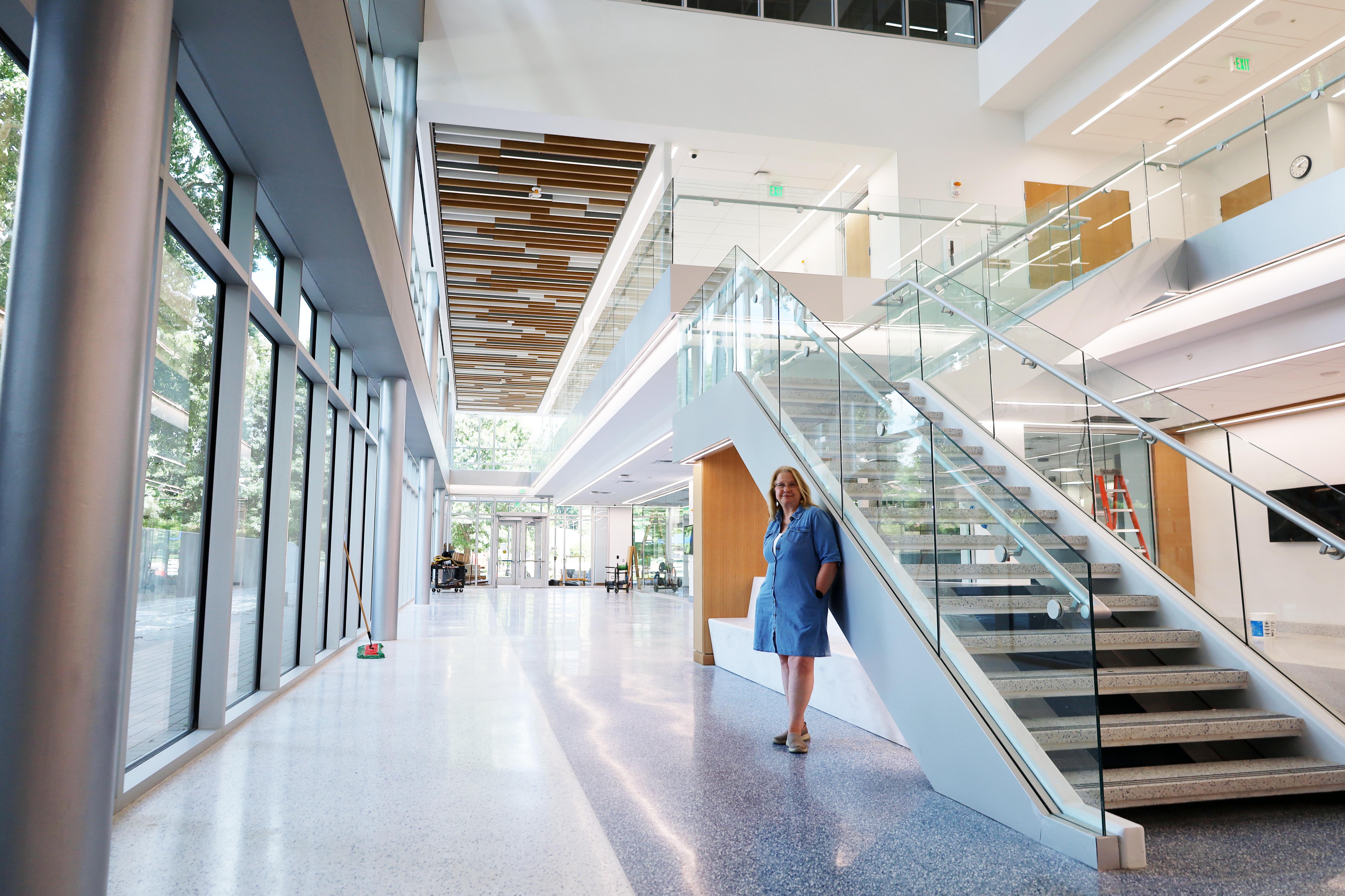 Sandy Redmon standing in Scovell Hall on near the first floor stairs