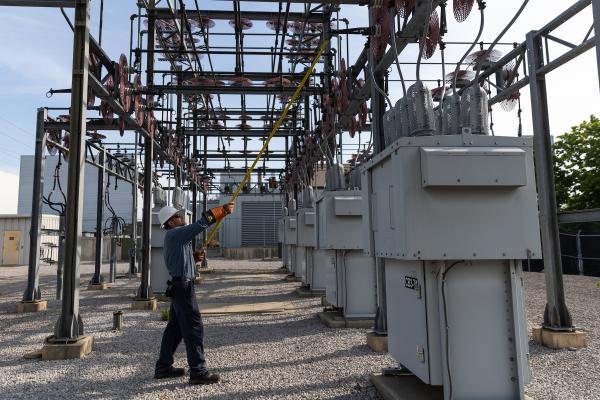 Utility worker at substation