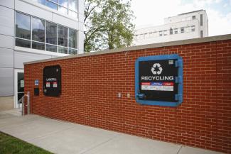 An image of an outdoor recycling compactor 