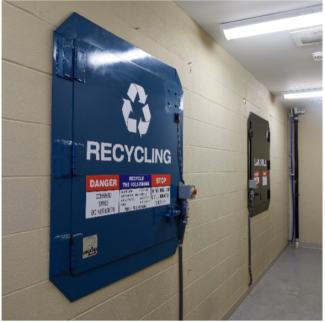 An image of an indoor recycling compactor