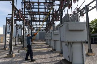 Utility worker at substation