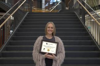 One person receiving the UK Sustainable Office Certification.