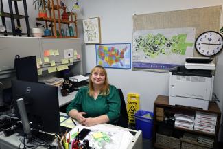 Woman sitting behind her desk