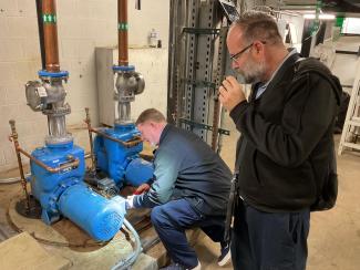 Two HealthCare maintenance team members working on a sanitary pipe in Pavilion WH