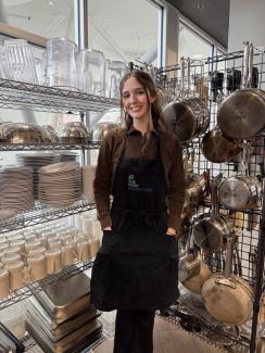 Student standing in kitchen 