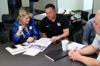 Sarah Baker in a meeting about renovation of Kroger Field suites