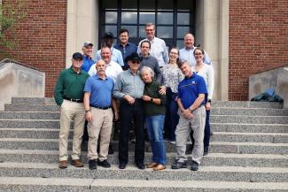 Bill Collins and colleagues outside Peterson Service Building