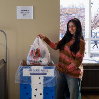 Shayna Bassi dropping off plastic bags in the BBN Tackles Plastic collection box.