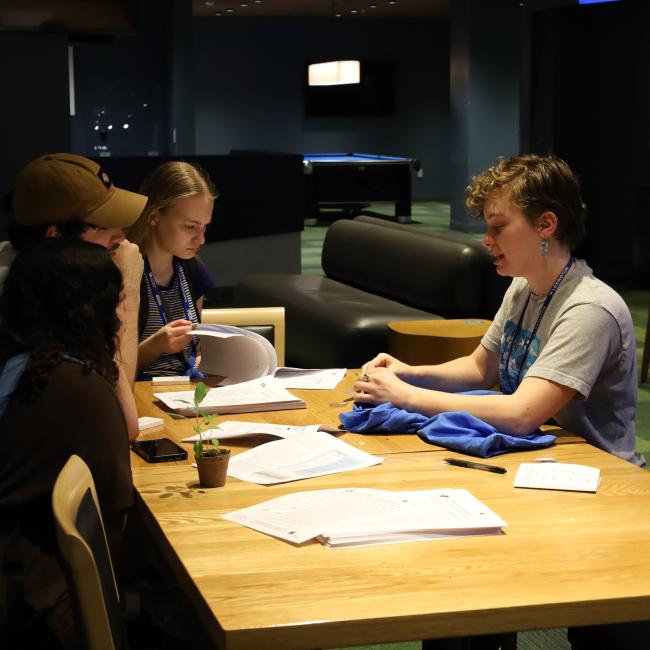 UK students learning how to mend clothes at DIY Day in 2023.