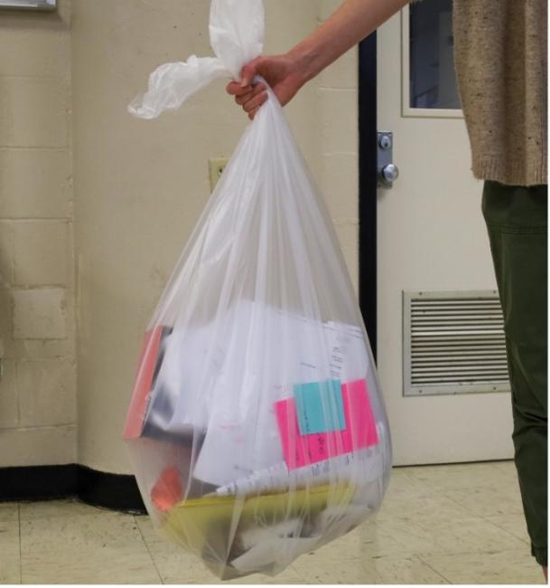 An image of a clear bag containing recycling 