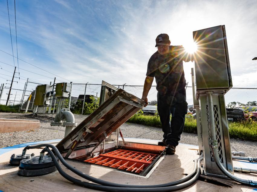 Facilities employee working on stormwater harvesting system.
