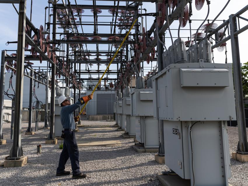 Utility worker at substation